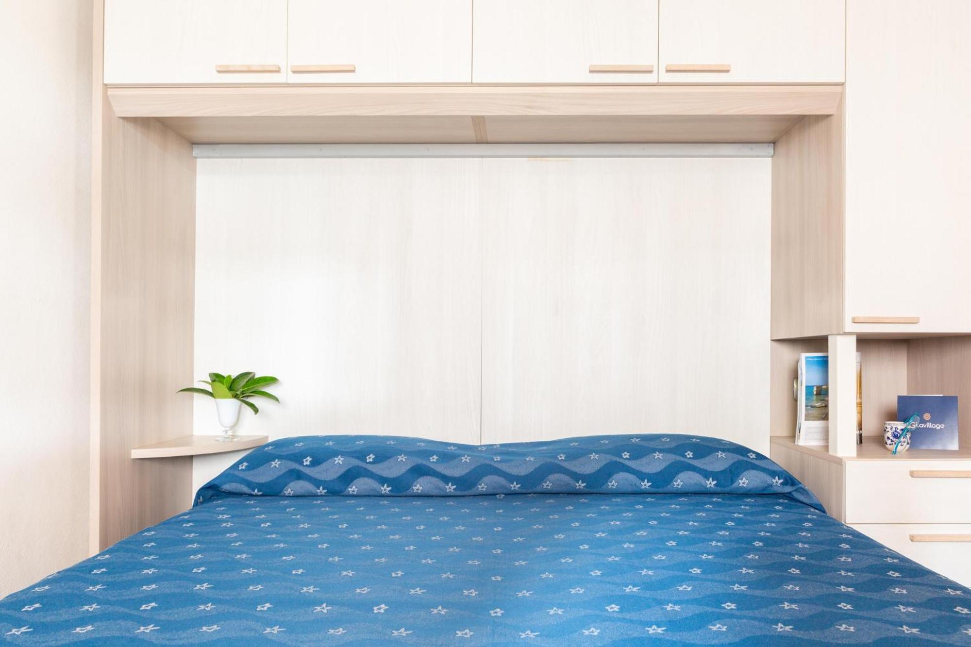 Gitavillage Argentario Албиния Экстерьер фото A futon on a bed